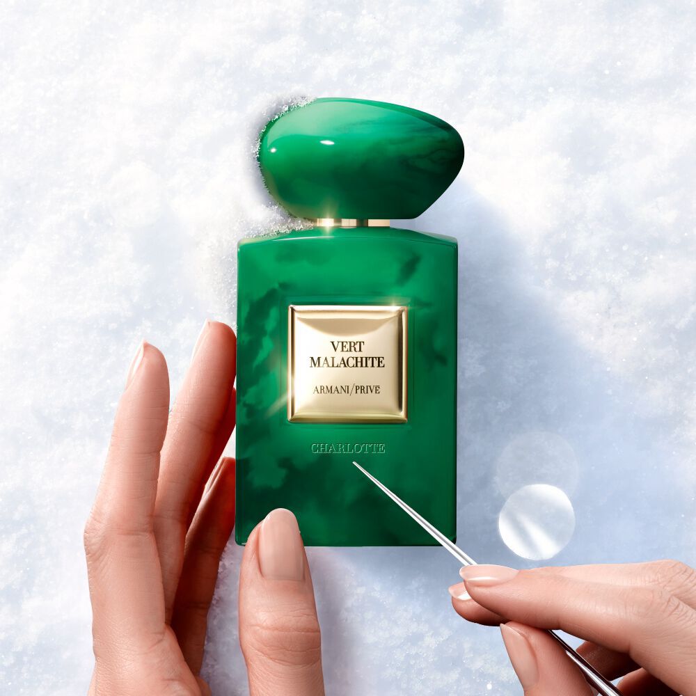Armani/Prive Vert Malachite fragrance being engraved for a personalized holiday gift.