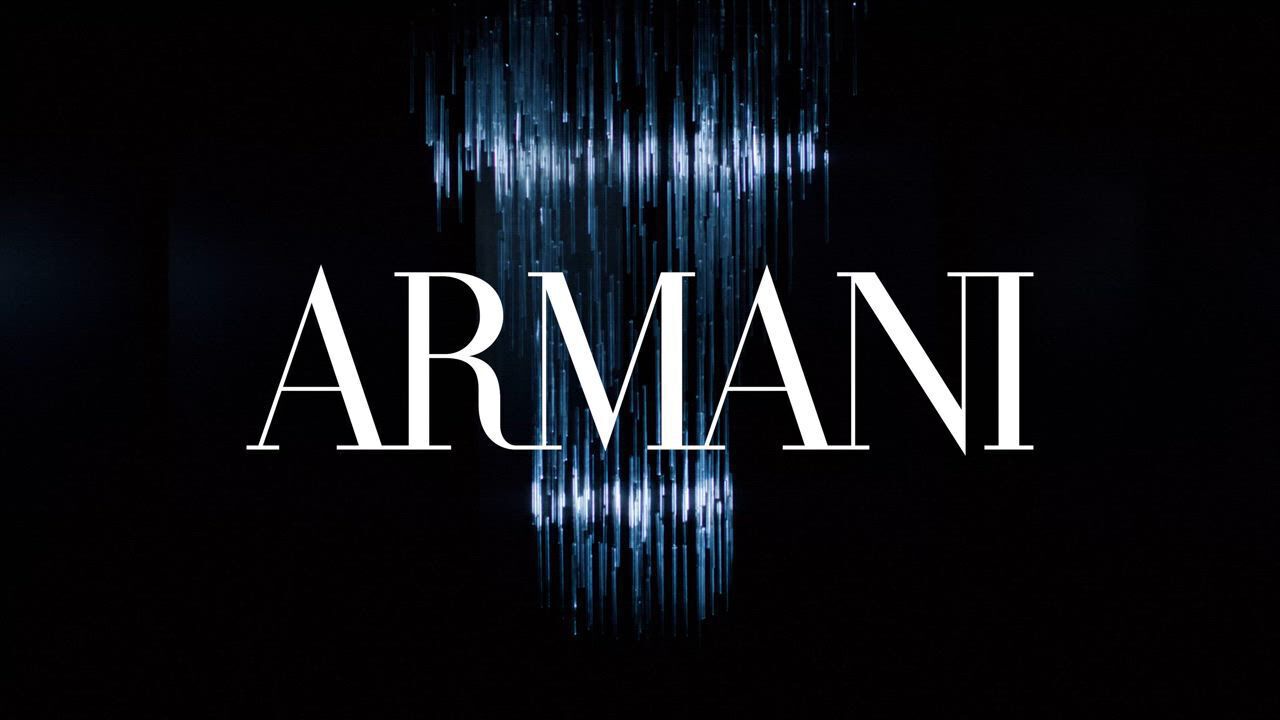 This video showcases Armani Beauty's holiday season collection. It features models at a party, showcasing various makeup products and fragrances. The overall atmosphere is festive and glamorous, with a focus on shimmering lights and elegant attire. The video highlights products such as lipstick, eyeshadow, and perfumes like "Si" and "Stronger With You."