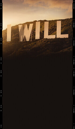 Giorgio Armani I WILL Eau de Parfum campaign visual with the I WILL sign in a cinematic landscape.