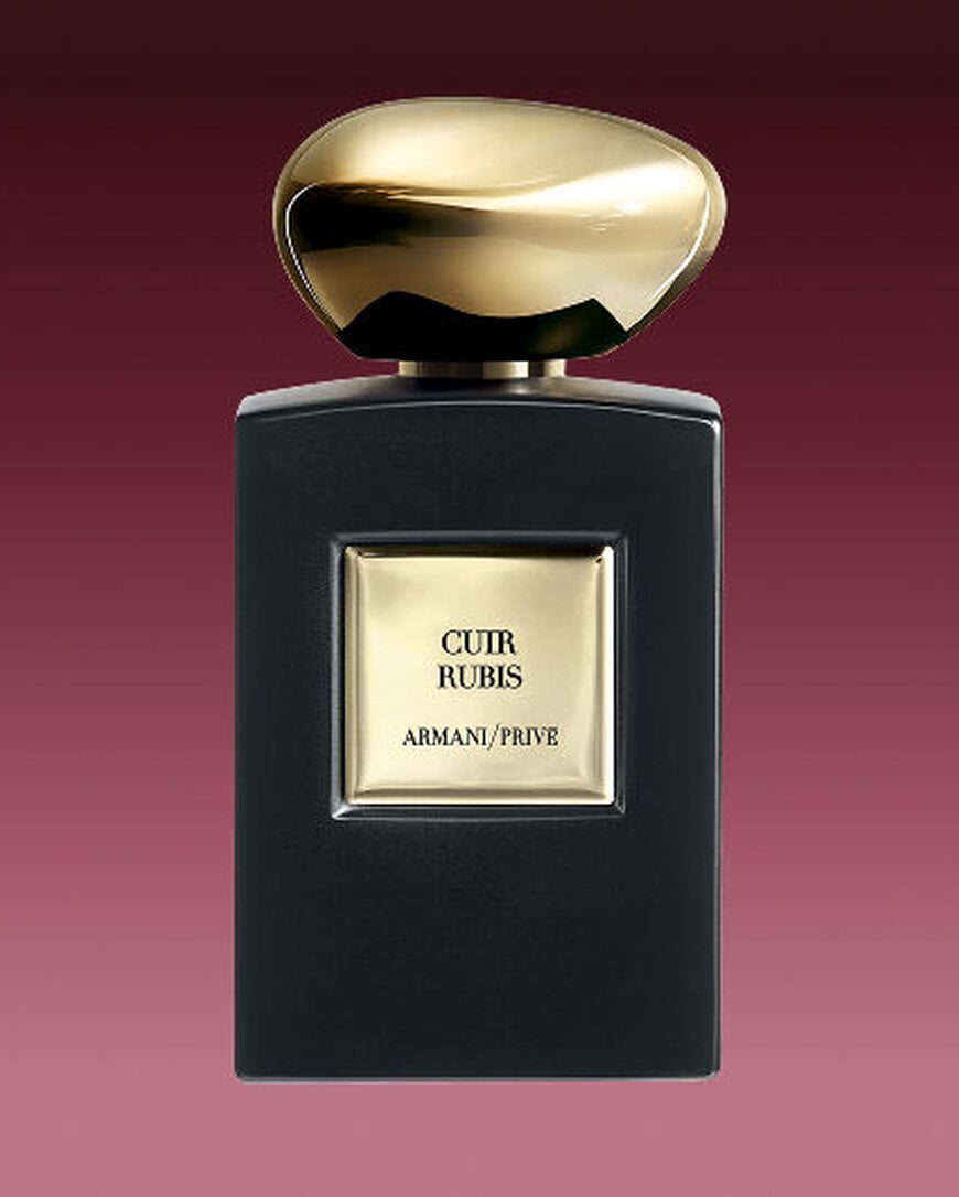Armani/Prive Cuir Rubis fragrance bottle with matte black finish and precious golden cap.