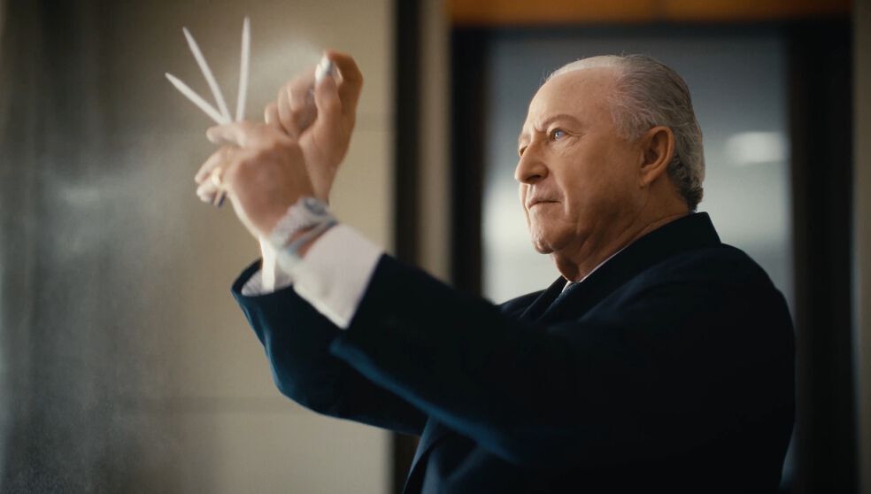 Perfumer spraying fragrance.