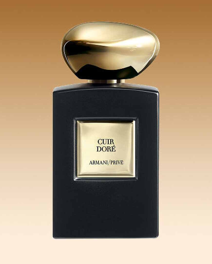 Armani/Prive Cuir Dore fragrance bottle with matte black finish and precious golden cap.