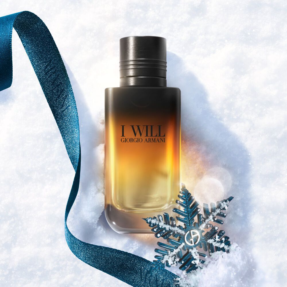 Giorgio Armani I Will fragrance on snow with a blue ribbon for a winter glamour gift.