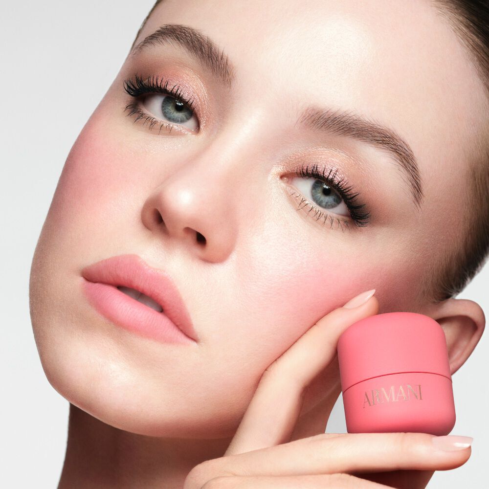 SYDNEY  holding the pink Armani Beauty Dolci Blush with a natural soft-matte finish.