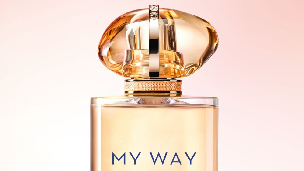 Armani My Way Sunny Vanila fragrance bottle with a gold-toned cap and soft pink background, highlighting its elegant and luxurious design.