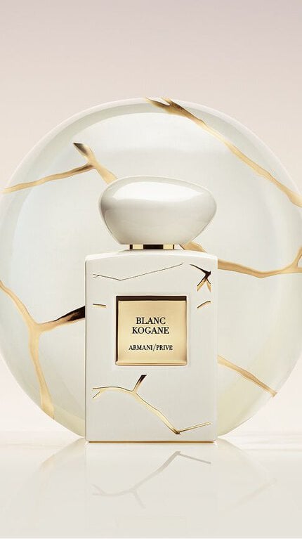Bottle of Armani/Prive Blanc Kogane against a light beige and white background.