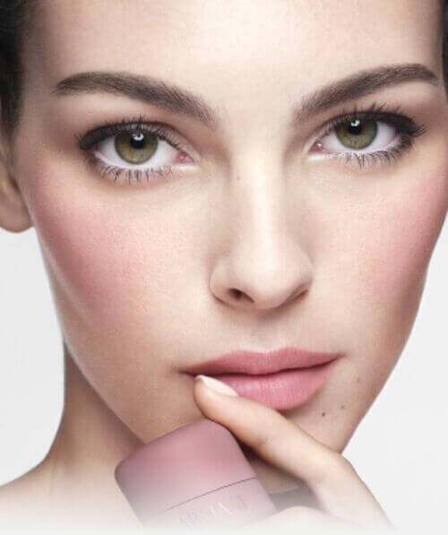 Vittoria holding ARMANI Beauty DOLCI blush near her face, showing a soft pink blush result on cheeks