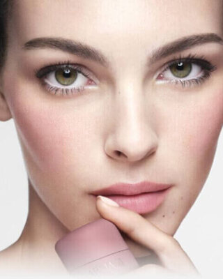 Vittoria holding ARMANI Beauty DOLCI blush near her face, showing a soft pink blush result on cheeks