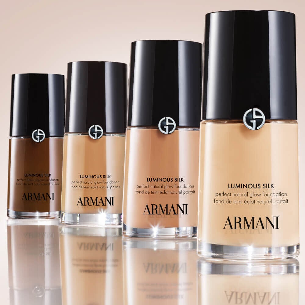 Four bottles of Giorgio Armani LUMINOUS SILK FOUNDATION in varying shades displaying SHADE CONVERTER