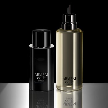 Side-by-side display of a full Armani Code Eau de Parfum bottle and a larger refill bottle. The refill bottle is transparent, revealing the pale yellow fragrance inside, and both have the Armani Code branding in white.