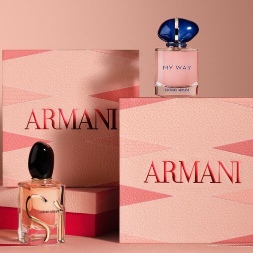 Armani gift sets featuring Si and My Way Eau de Parfum bottles, displayed with elegant pink and red Armani Mother's Day boxes on a matching geometric background.