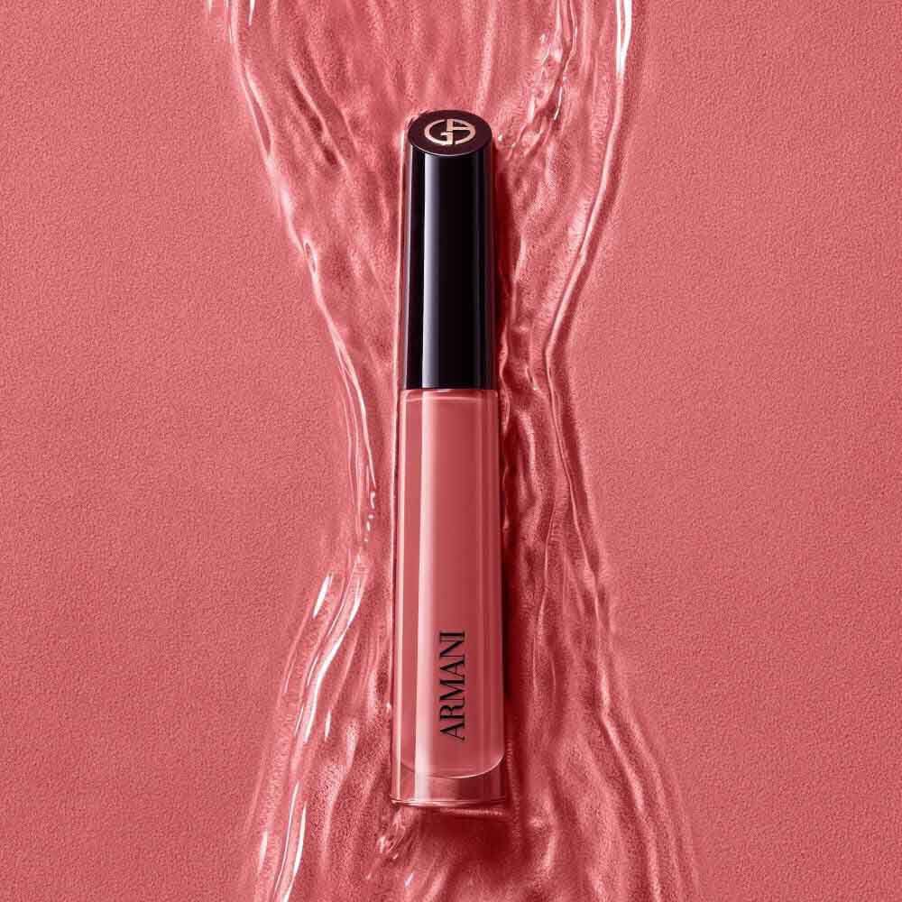 ARMANI LIP MAESTRO in shade 520 Dusty Rose standing upright on a rippled pink background.