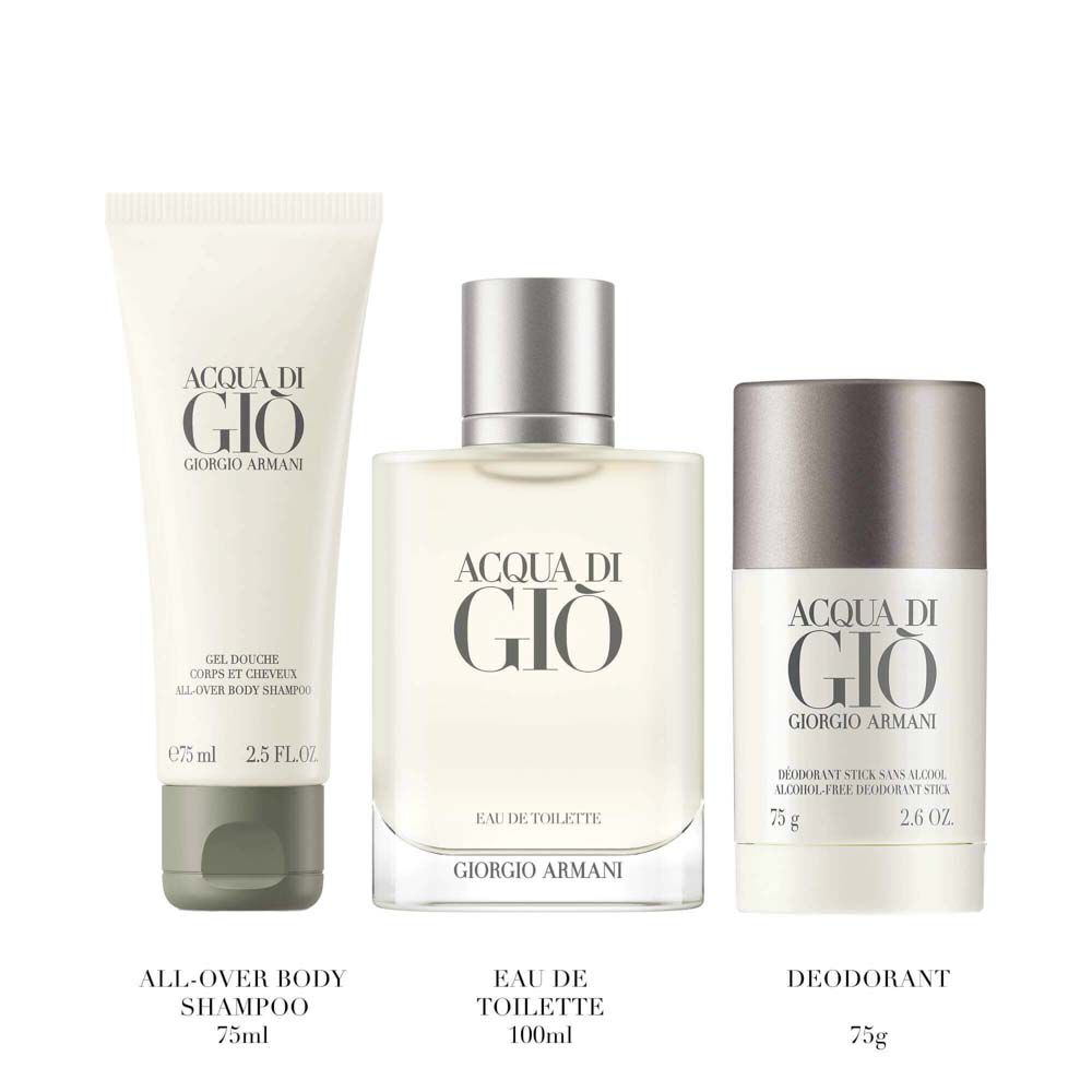 Giorgio Armani Acqua di Gio Eau de Toilette 100ml gift set — signature bottle, All-Over Body Shampoo 75ml and Deodorant Stick 75g displayed side by side on a pale surface.