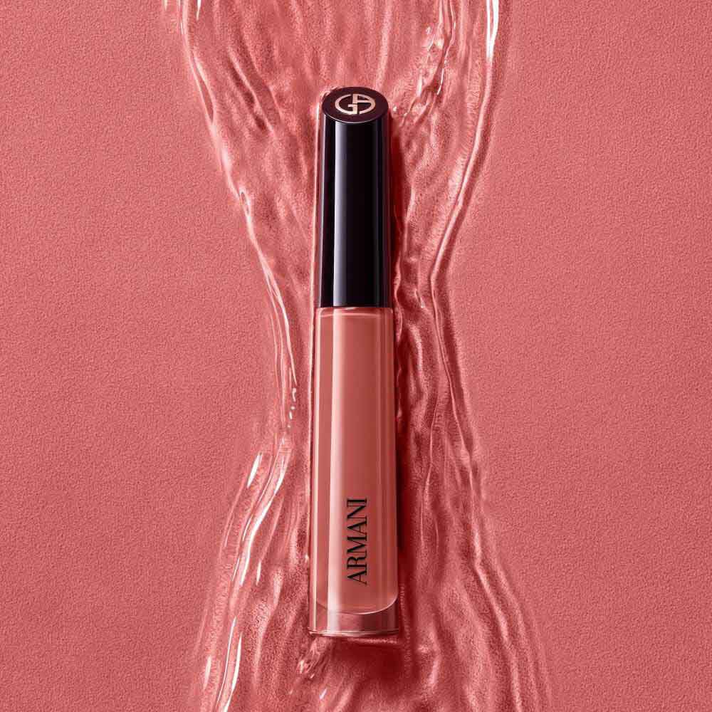 ARMANI LIP MAESTRO in shade 520 Dusty Rose standing upright on a rippled pink background.