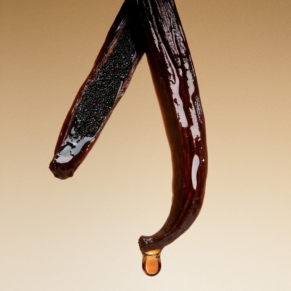 Bourbon Vanilla pods with a warm golden drop.