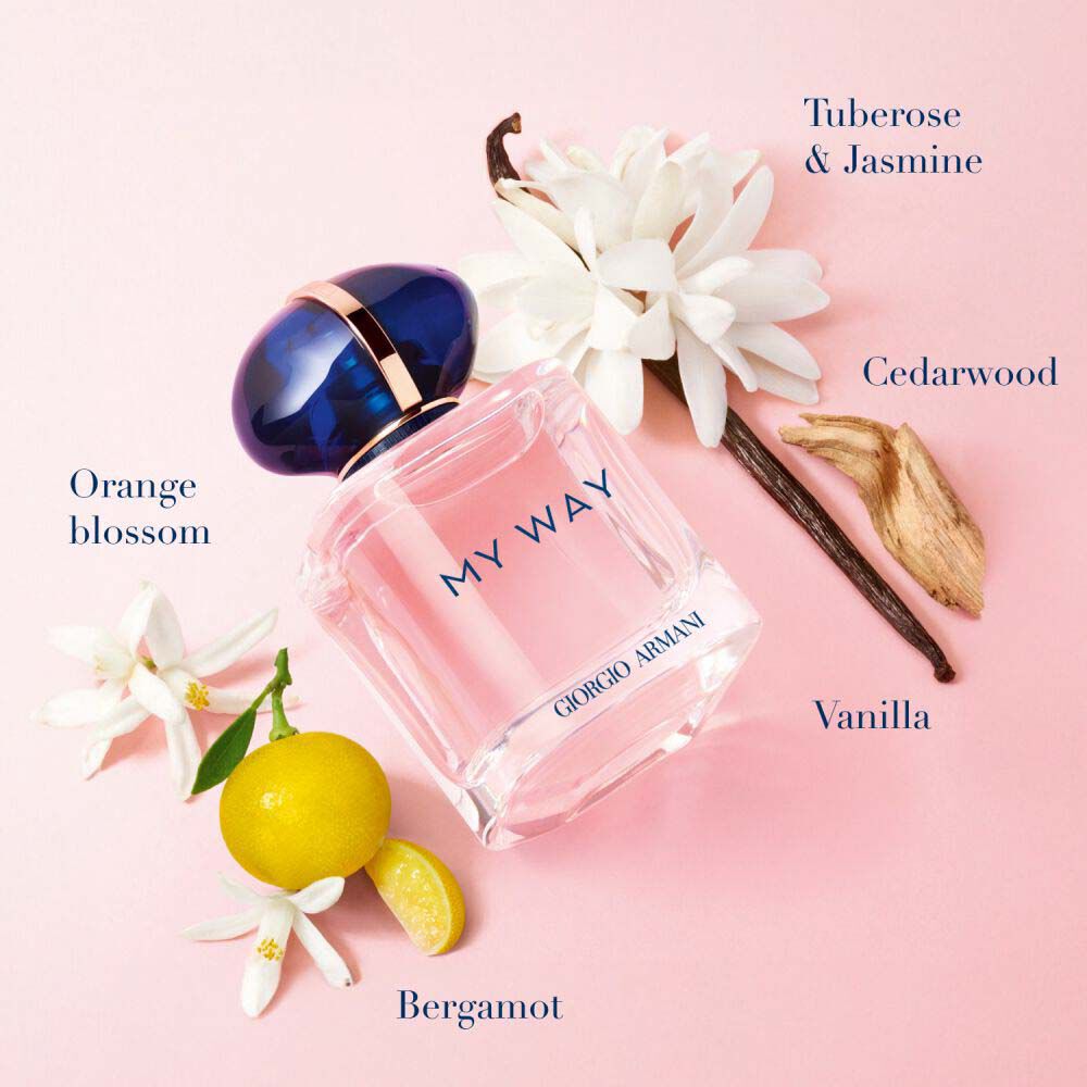 My Way Eau de Parfum by Giorgio Armani, blush pink bottle surrounded by orange blossom, bergamot, tuberose, jasmine, vanilla and cedarwood on a soft pink background — women's floral fragrance.