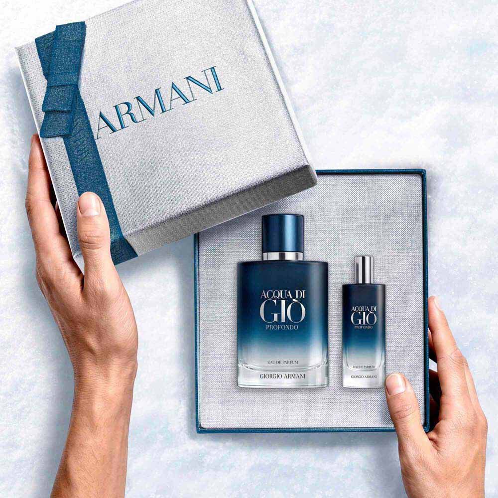 Giorgio Armani Acqua di Gio Profondo Eau de Parfum 100ml gift set — signature bottle and 15ml bottle from within the open Armani gift box, an intimate unboxing moment.