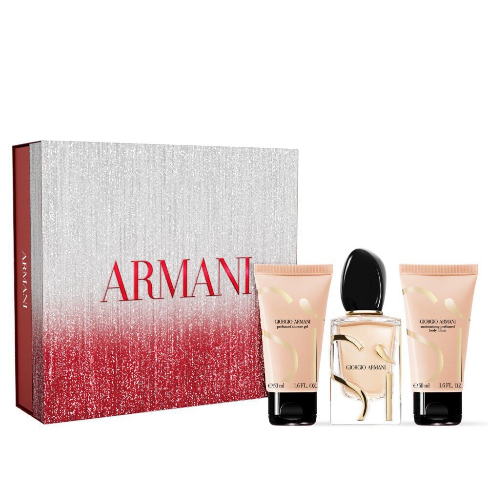 Si Eau de Parfum 50ml, Si Eau de Parfum Body lotion 50ml and Si Eau de Parfum Shower Gel 50ml. presented in front of a festive red and silver ARMANI gift box.	