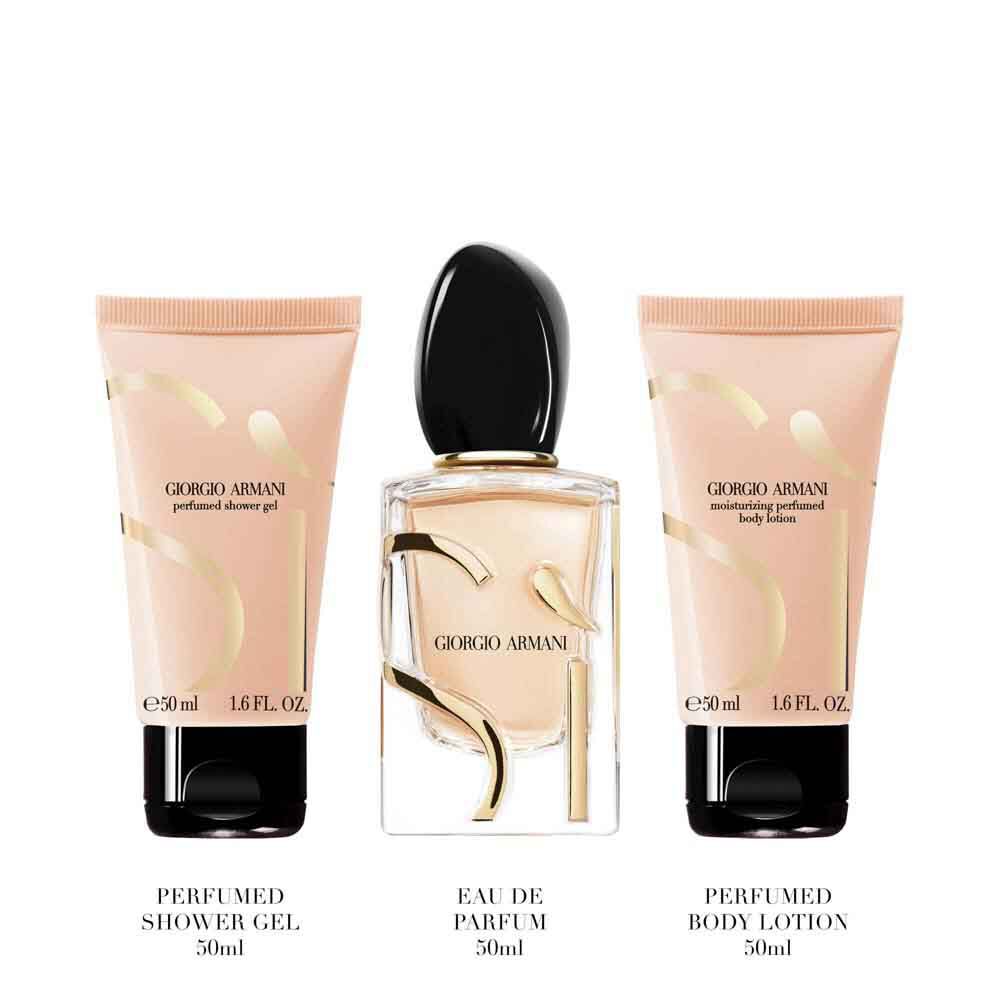 Si Eau de Parfum 50ml, 50ml perfumed body lotion and 50ml perfumed shower gel standing upright — Giorgio Armani women's floral fragrance gift set, white background.