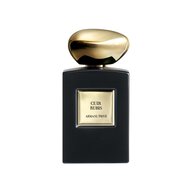 Armani/Prive Cuir Rubis fragrance in its black bottle with golden cap.