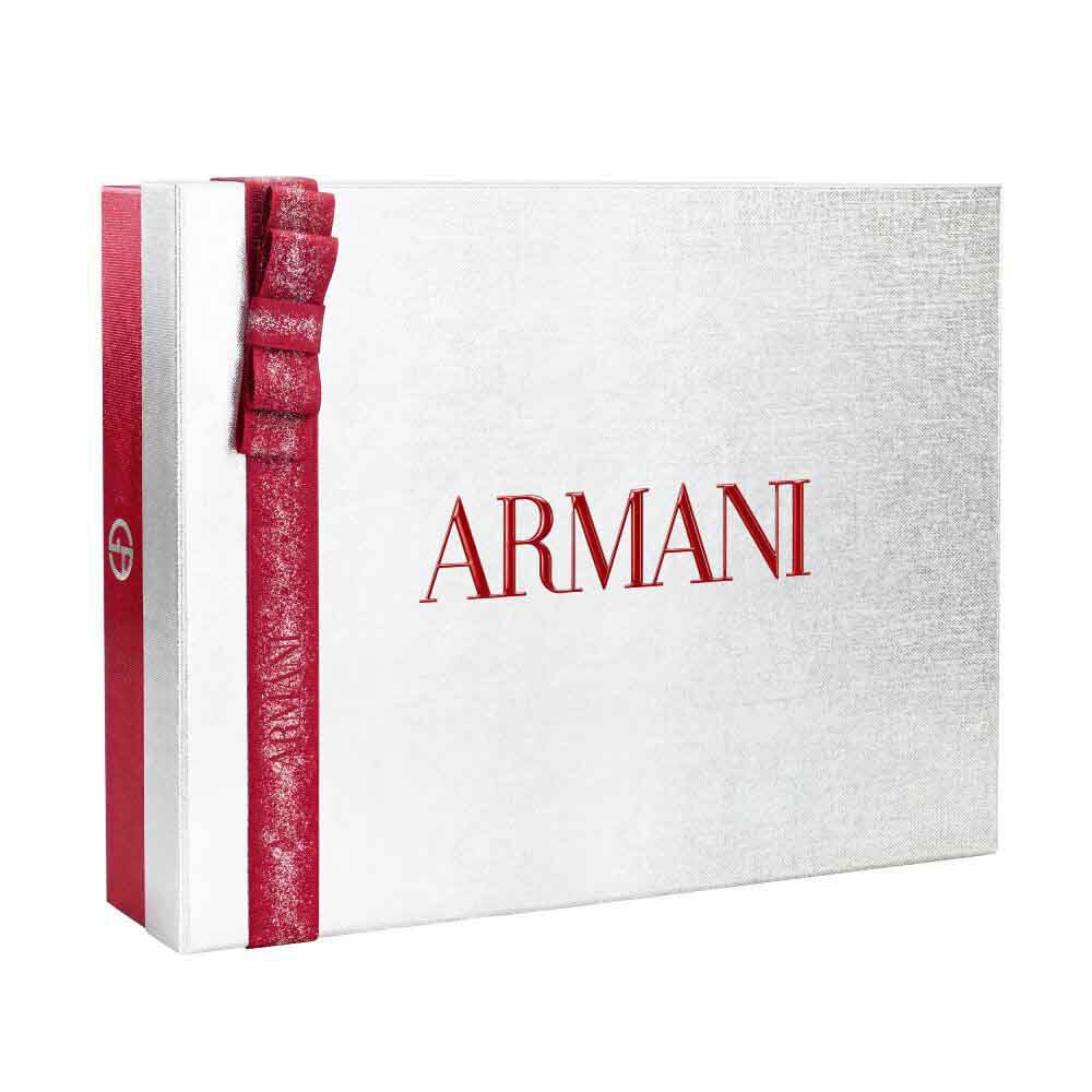 Silver Armani holiday gift box with glittered red ribbon bow — Glamourous Winter Holiday Gift Set Box, white background.