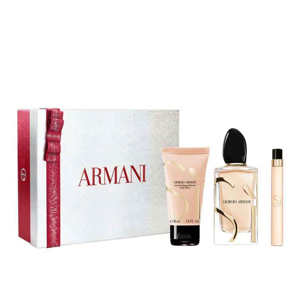 Si Eau de Parfum 100ml, Travel size10ml and 50ml perfumed body lotion in a sleek gold-toned bottle trio, nestled in an open white Armani gift box with red ribbon — women's floral fragrance gift set.