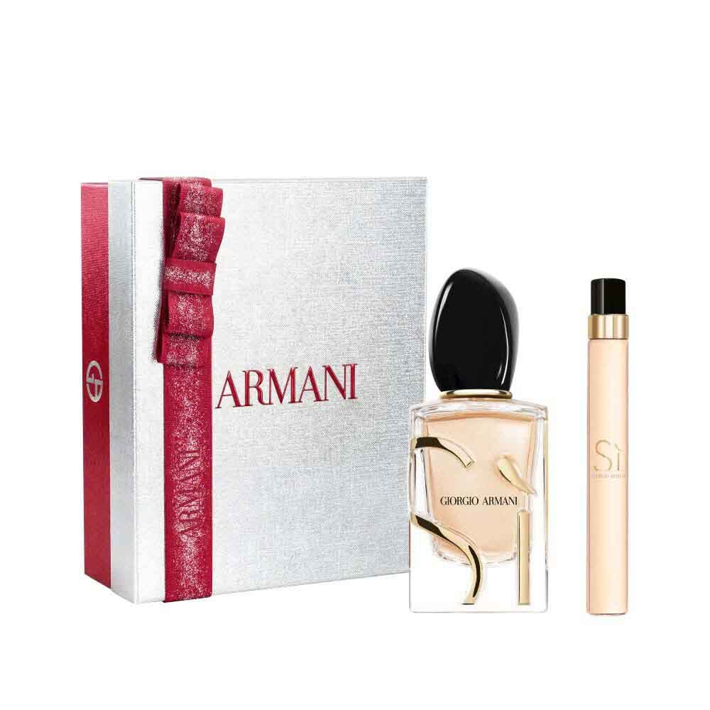 Si Eau de Parfum 50ml and 10ml in a sleek gold-toned bottle duo, nestled in an open white Armani gift box with red ribbon — women's floral fragrance gift set.