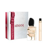 Si Eau de Parfum 50ml and 10ml in a sleek gold-toned bottle duo, nestled in an open white Armani gift box with red ribbon — women's floral fragrance gift set.