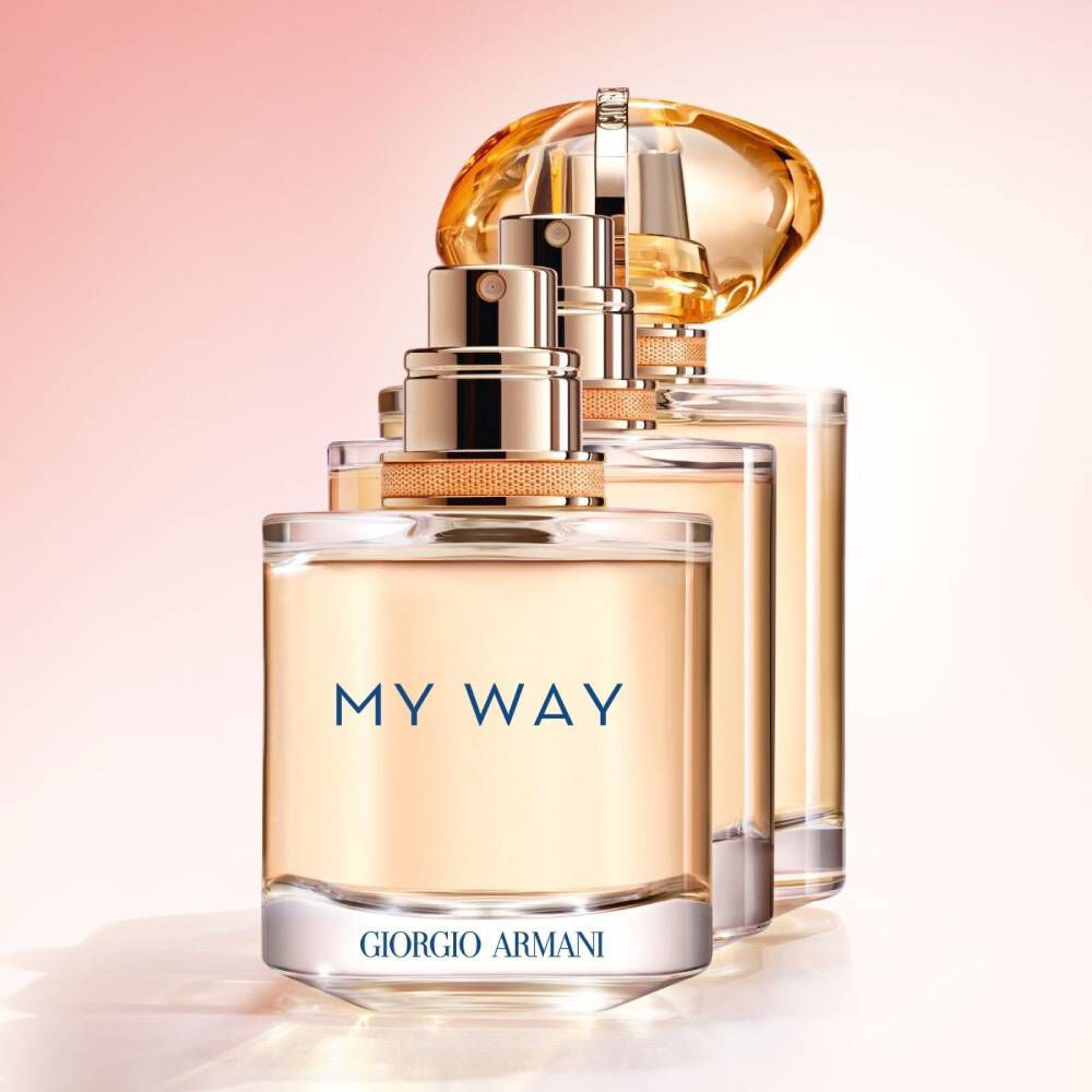 Armani My Way Sunny Vanilla perfume bottle showcased in 3 different sizes with its elegant gold cap, reflecting luxury and sophistication on a pastel background.