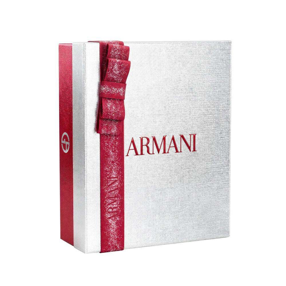 Silver Armani holiday gift box with glittered red ribbon bow — Glamourous Winter Holiday Gift Set Box, white background.