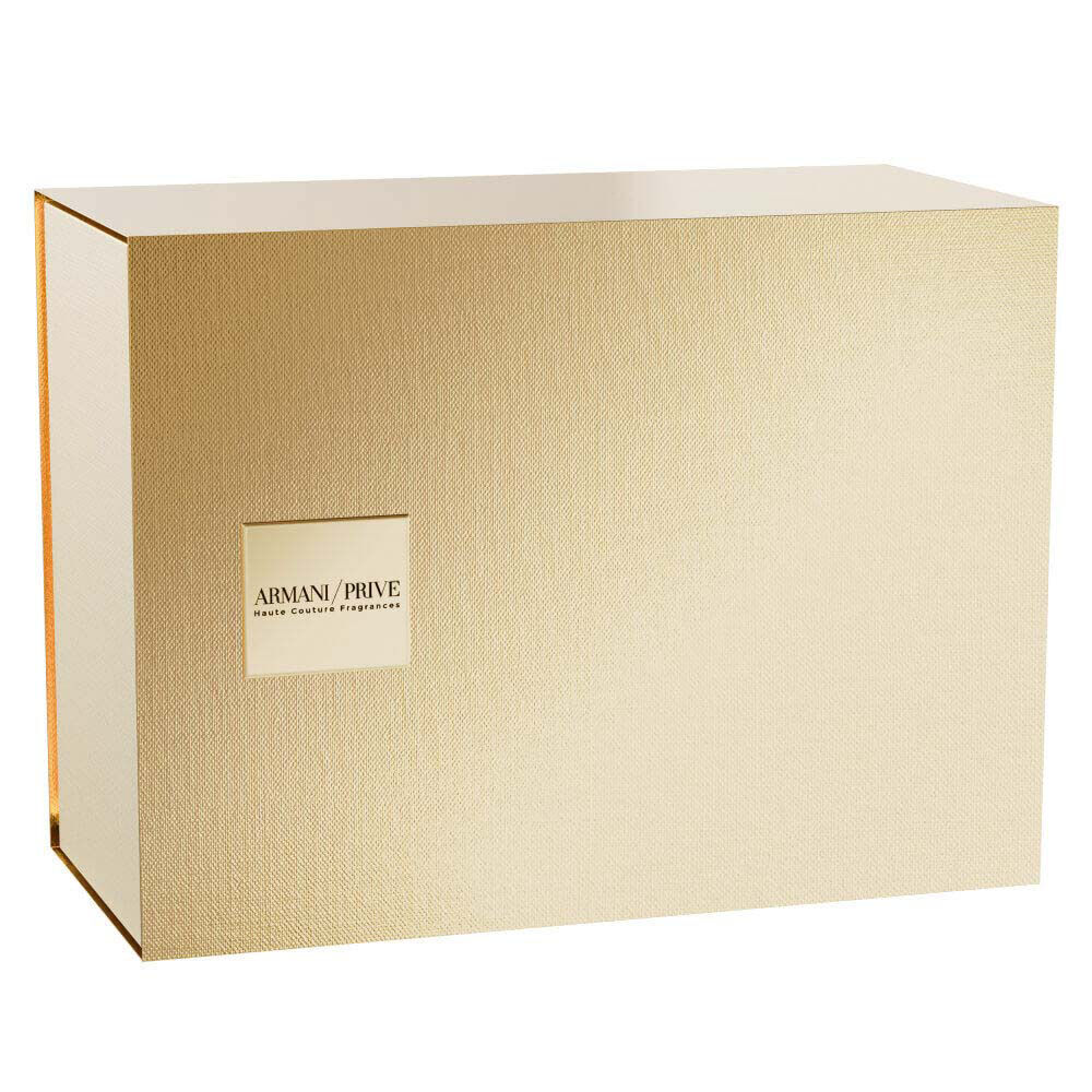 Armani Prive Les Eaux The Yulong Holiday gift set closed gold rectangular box with embossed Armani Prive branding, photographed on a white background.