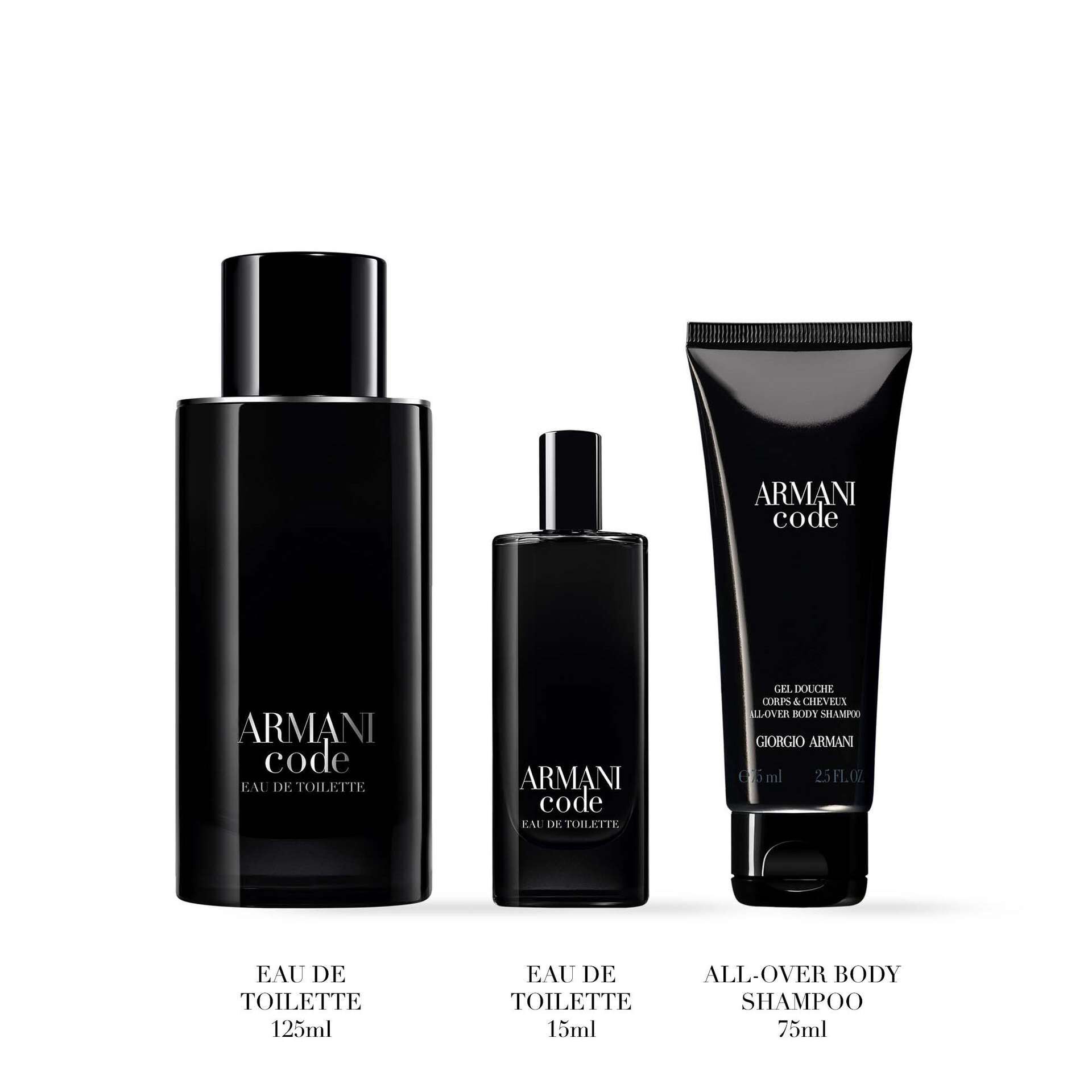 Three Armani Code products are arranged side by side against a white background. From left to right: a large black bottle labeled “Eau de Toilette 125ml,” a smaller matching bottle labeled “Eau de Toilette 15ml,” and a black tube labeled “All-Over Body Shampoo 75ml.”