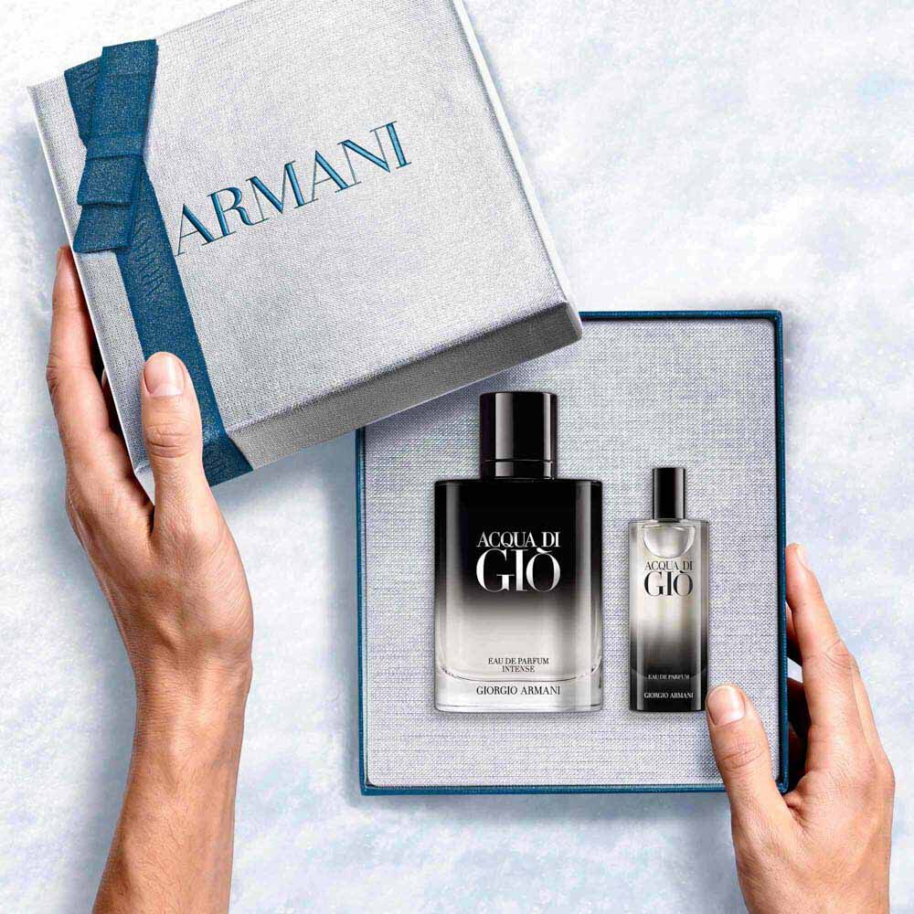 Giorgio Armani Acqua di Gio Profondo Eau de Parfum 100ml gift set — signature bottle and 15ml bottle from within the open Armani gift box, an intimate unboxing moment.