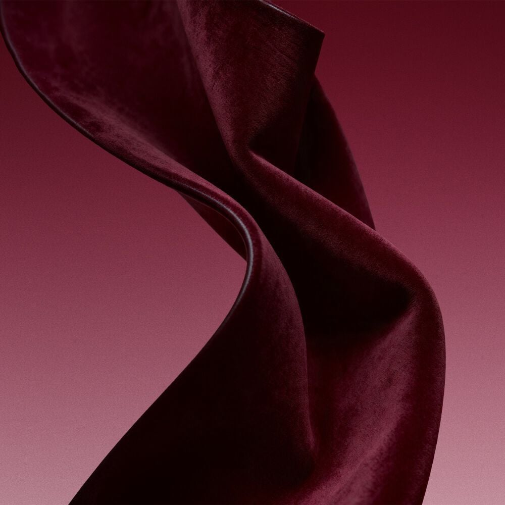 Burgundy fabric texture evoking the leather accord of Cuir Rubis.