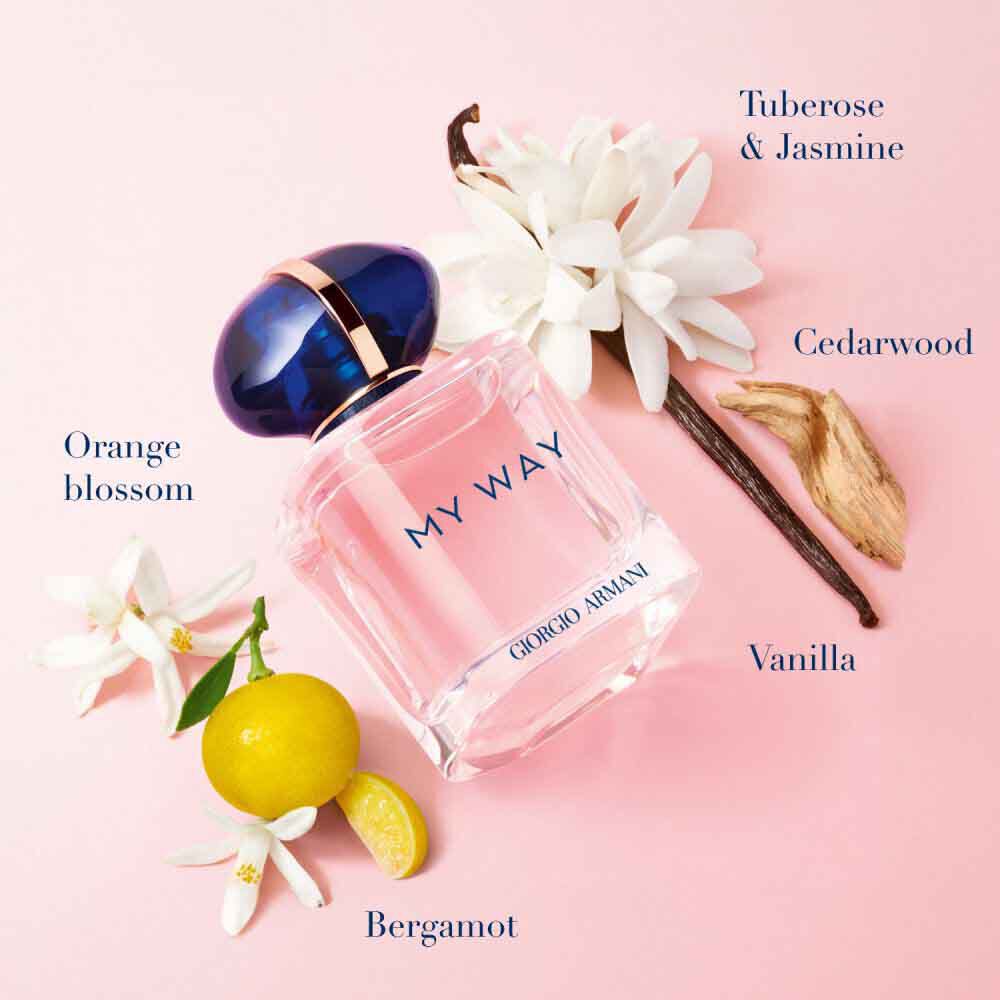 My Way Eau de Parfum by Giorgio Armani, blush pink bottle surrounded by orange blossom, bergamot, tuberose, jasmine, vanilla and cedarwood on a soft pink background — women's floral fragrance.