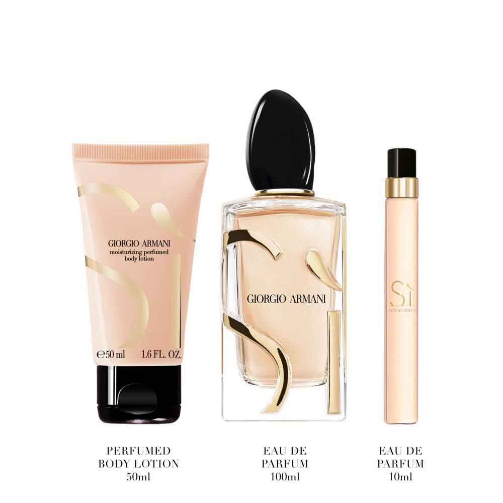 Si Eau de Parfum 100ml, Travel size10ml and 50ml perfumed body lotion signature gold-toned bottles standing upright — Giorgio Armani women's floral fragrance gift set, white background.