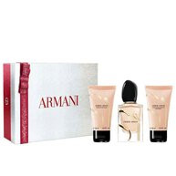 Si Eau de Parfum 50ml, 50ml perfumed body lotion and 50ml perfumed shower gel in a sleek gold-toned bottle trio, nestled in an open white Armani gift box with red ribbon — women's floral fragrance gift set.