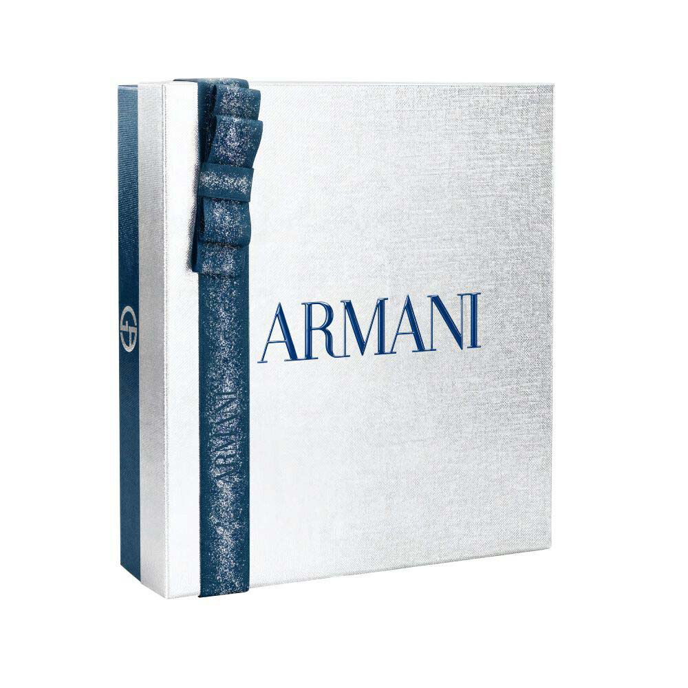 Giorgio Armani Acqua di Gio — white and silver Armani gift box tied with a blue satin ribbon, holiday gifting presentation on a clean white surface.