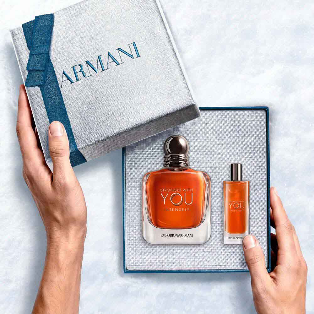 Emporio Armani Stronger With You Intensely Eau de Parfum 100ml — gift set with signature amber bottle and Stronger With You Intensely 15ml bottle from within the Armani gift box, an intimate unboxing moment.